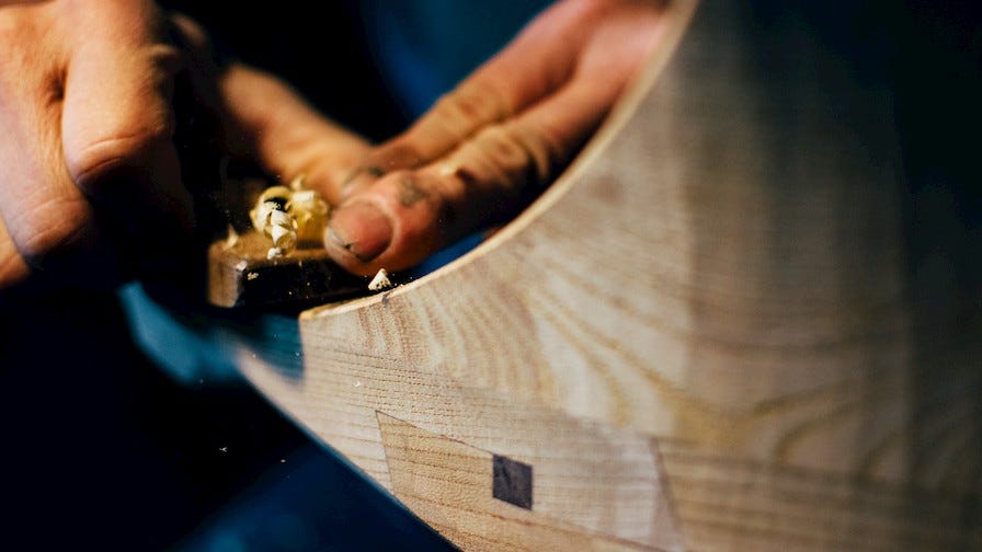 Woodworker Tak Yoshino carving wood